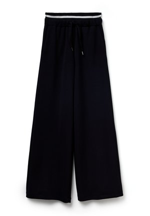 Zwarte broek met wijd uitlopende pijpen, gemaakt van zachte stof, met een elastische tailleband met een trekkoord en contrasterende witte strepen aan de bovenkant.