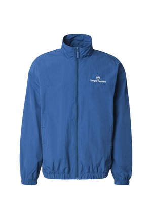 Giacca antivento blu con cerniera, polsini ed orlo elasticizzati, con il logo Sergio Tacchini sul petto a sinistra.