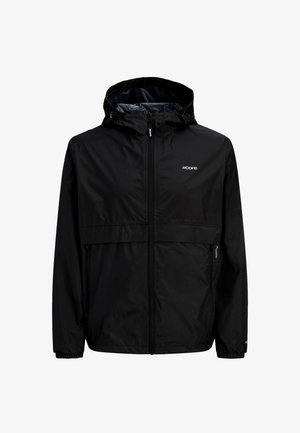 Must kapuutsiga vihmajope, millel on elastsed varrukaotsad, esitaskud ja rinnal "core" logo.