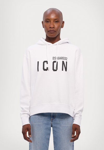 Witte hoodie van zacht materiaal, met een zwarte vooropdruk "ICON", voorzien van een verstelbare trekkoordkap en geribbelde manchetten.