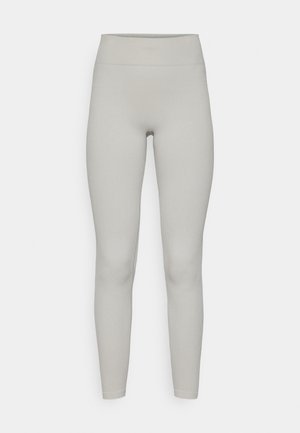 Ribbed leggings in a light grey color with a high waistband, featuring a fitted design and smooth texture. No visible patterns or accents.