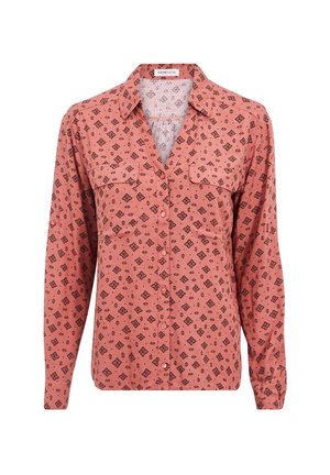 Koszula z długim rękawem w odcieniu brzoskwiniowym z geometrycznym czarnym wzorem, zapinana na guziki z przodu, z dwiema kieszeniami na piersi i kołnierzykiem. Miękki, lekki materiał.