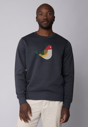 Marineblauw crewneck sweatshirt met een kleurrijke vogelafbeelding op de voorkant, gemaakt van zachte stof met ribgebreide boorden en onderrand.
