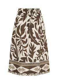 Brun och vit mönstrad kjol med elastisk midja. Har tropiska bladmönster och en dekorativ kant vid fållen.