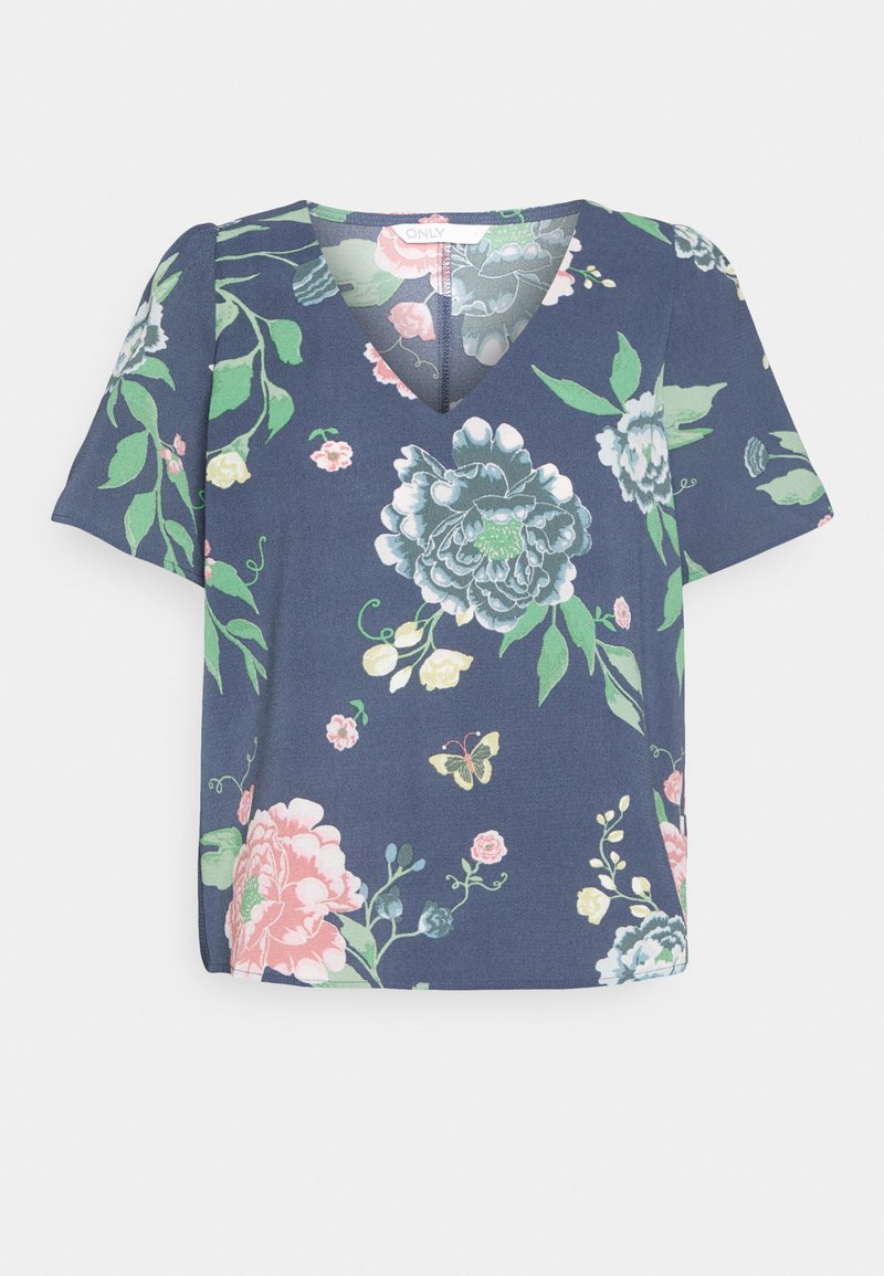Blusa floral com mangas curtas, decote em V, fundo azul-marinho, apresentando grandes flores em rosa, verde e azul. Tecido suave com padrões distintos.