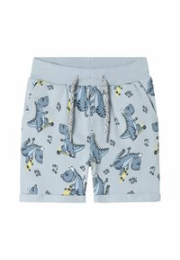 Ljusblå barnshorts i bomull, med dinosaurtryck, elastisk midja med snörning och fållade benslut.
