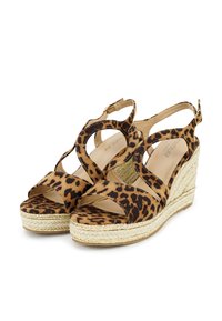 Leopard print suede wedge sandals with cross-strap design, natural jute sole, and gold-tone accents along the platform.