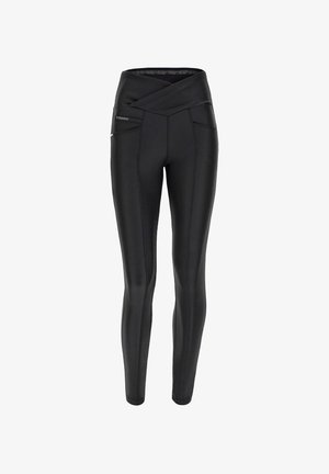 Mustat korkea vyötärö legginsit, joissa on ristiin menevä vyötärönauha, tyylikäs pinta ja erottuva ommel. Sisältää sivutaskut käytön helppouteen.