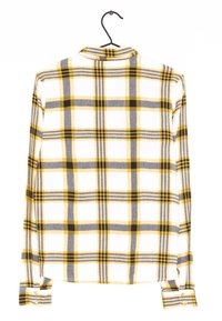 Camicia a maniche lunghe a quadri con quadrati gialli, grigi e neri su sfondo bianco, dotata di colletto e polsini con bottoni.