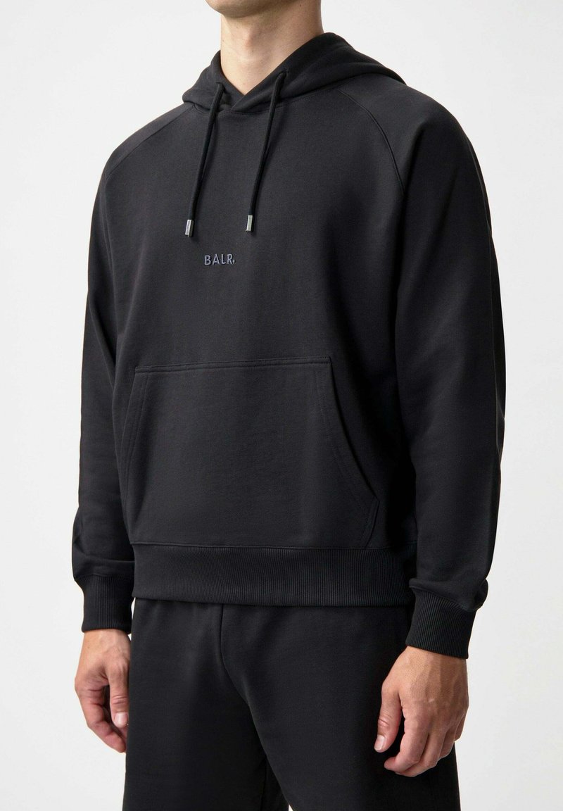 Black hooded sweatshirt made of soft fabric, featuring a kangaroo pocket, ribbed cuffs and hem, and a small embroidered logo at chest.