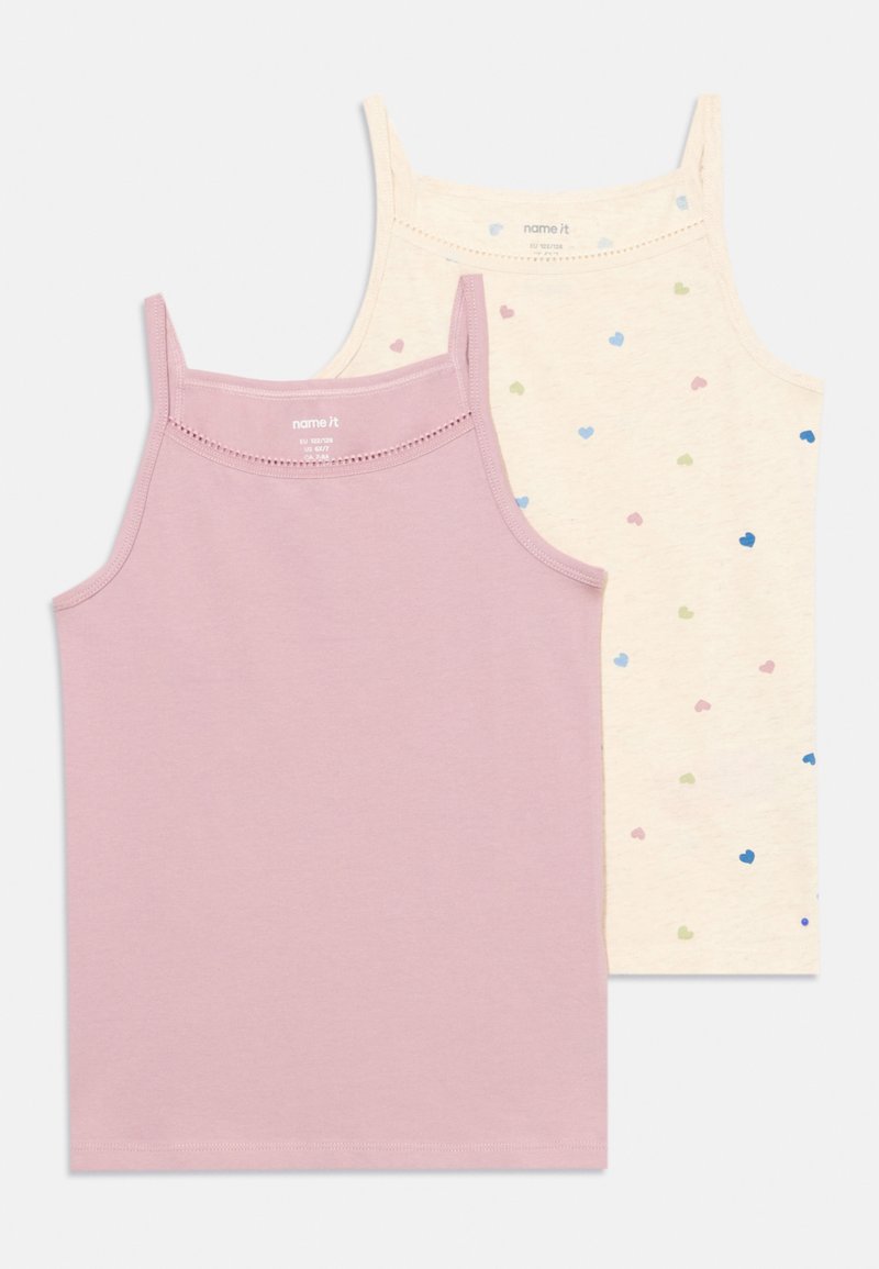Two tank tops: one lavender solid, one beige with colorful heart patterns. Both feature adjustable straps and a soft texture.