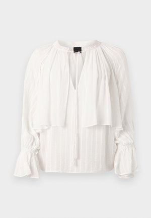 White blouse with a pleated design, V-neck, and layered front. Features long, puffed sleeves with gathered cuffs and a tassel tie detail.