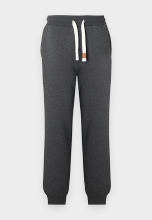 Pantaloni della tuta grigio scuro realizzati in tessuto morbido, con vita regolabile tramite coulisse bianche e polsini aderenti alle caviglie.