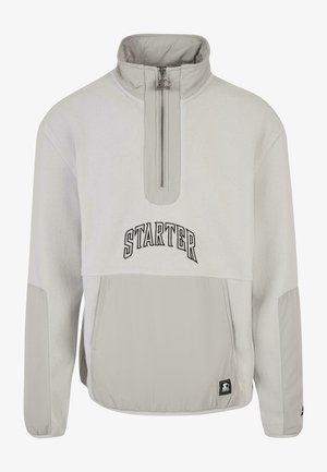 Light gray fleece pullover with a half zipper and high collar. Features black "STARTER" text and one front pocket with elastic bottom.