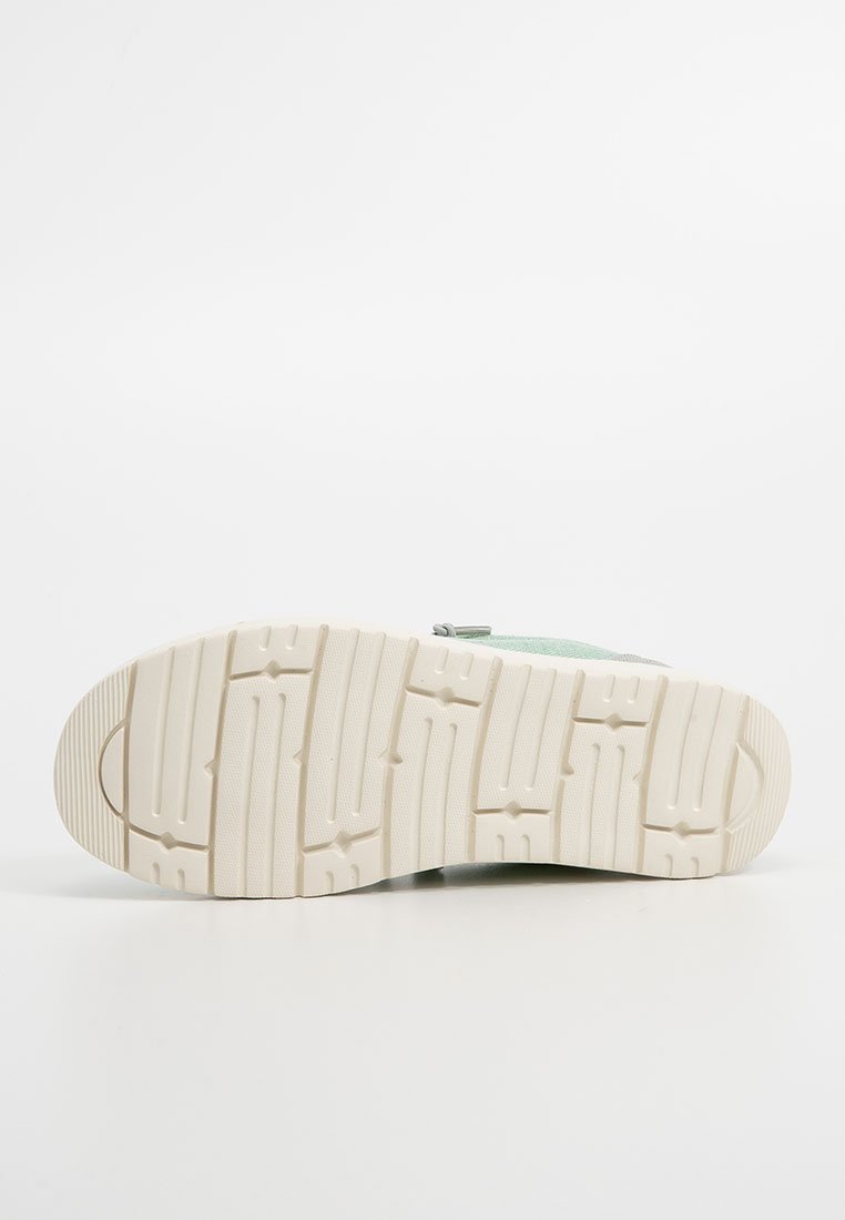 Suola della scarpa in gomma leggera beige chiaro con una texture. Presenta un battistrada decorato per una migliore aderenza, bordi arrotondati con un dettaglio logo in rilievo.
