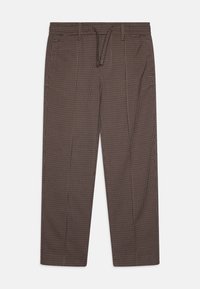 Bruine geruite broeken met een loose fit, elastische tailleband en trekkoord. Beschikt over zijzakken en een gladde textuur.