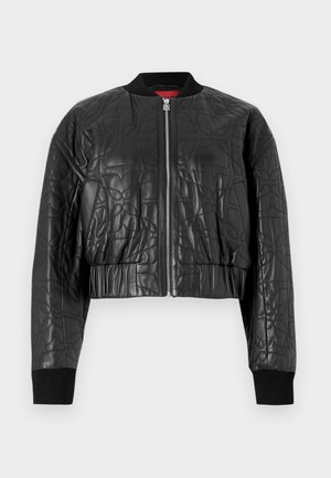 Black bomber jacket made of quilted leather. Features a zip front, ribbed cuffs, and a cropped design with subtle embossed patterns.