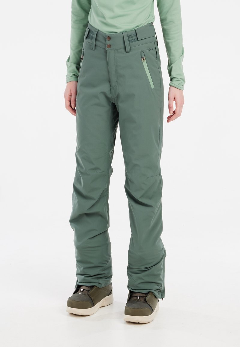 Pantalon de neige vert, imperméable, coupe décontractée, poches zippées, ceinture avec deux boutons. Texture lisse, adapté pour une utilisation en plein air.