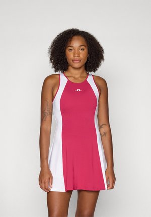 Racerback dress made of stretch fabric; features a pink body with white side panels; logo at chest; smooth texture.