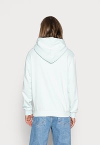 Weekday STANDARD HOODIE - Sweatshirt com capuz - light blue