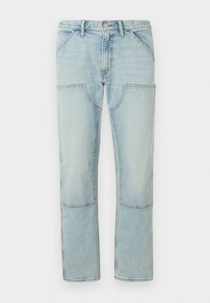 Light blue denim jeans with a straight leg, featuring patch pockets and a faded finish. Button closure at the waist, standard belt loops.