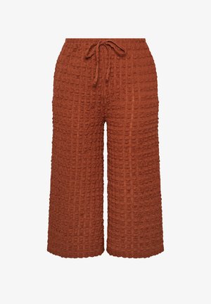 Pantaloni a gamba larga color ruggine con texture, dotati di cintura elastica e coulisse frontale.