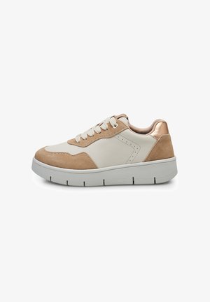 Beige ja kreemi nahast pealsed spordijalatsid, milliseid kaunistavad metallik pronksist detailid, paks hall tallaga ja ümarate paeltega.