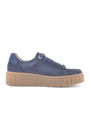 Navy blue suede low-top sneaker with thick light brown rubber sole and matching navy laces, viewed from the side.