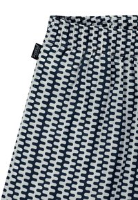 Mønstret stoff i marineblått og krem, med et bølgete design. Elastisk midjebånd med sammensydd søm. Merke synlig i øvre hjørne.