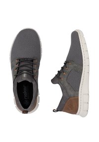 Gray mesh sneakers with a synthetic upper, featuring a tan accent, perforated design, and a white rubber sole. Adjustable laces included.