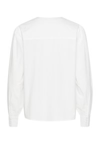 Hvid langærmet skjorte lavet af glat stof, med rund hals, samlet skulderdetalje og knapmanchetter samt en afslappet pasform.