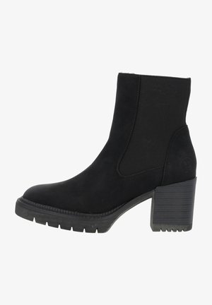 Bottine noire à talon épais, panneau latéral élastique et semelle crantée pour une bonne adhérence, conçue pour un usage décontracté ou semi-formel.