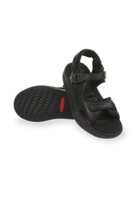 Sandalias de cuero negro con correas ajustables, una plantilla texturizada y una suela de goma con un diseño y un acento rojo.