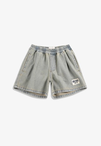 Light blue denim shorts with elastic waistband, side pockets, and a white patch labeled "BOBO CHOSES SINCE '09" on the left leg.