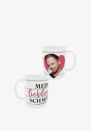Keramiktasse mit einem lächelnden Gesicht in einem pinken Herzen auf einer Seite, mit schwarzen und pinken Texten, die "MEIN Lieblings SCHMIDT" auf weißen Streifen lesen.