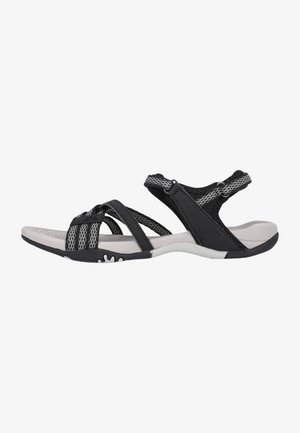Black sandals with mesh straps and padded footbed. Features cross-over design, adjustable closures, and textured rubber sole.