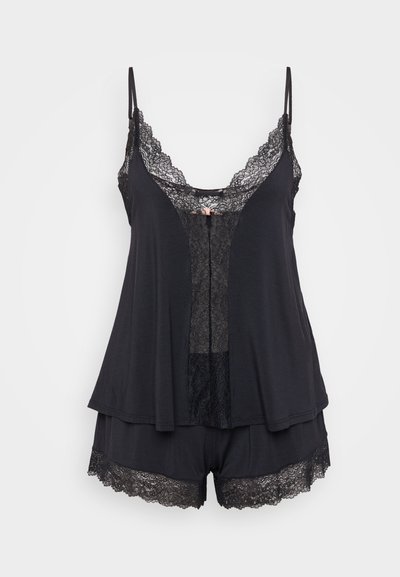Black sleep set featuring a tank top with lace trim, V-neckline, and shorts with lace accents. Soft fabric, relaxed fit, and delicate details.