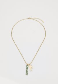 Collier en or avec un pendentif « LACOSTE » en vert et or, accompagné d'un charme crocodile. Design à maillons texturés. Longueur adjustable.