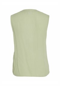 Top senza maniche di un verde chiaro, realizzato in un tessuto morbido e testurizzato, con un design semplice e un orlo posteriore arrotondato per una vestibilità comoda.