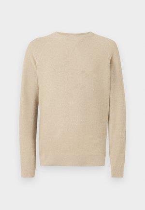 Beige knit sweater with long sleeves and ribbed cuffs and hem, featuring a textured pattern and a round neckline.