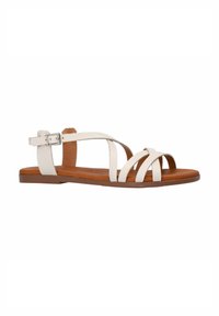 White leather sandals with multiple crisscross straps, a buckle closure, and a brown flat sole for comfort. Textured material detail visible.