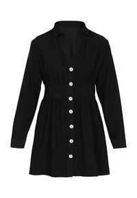 Schwarzes Hemdkleid aus weichem Stoff. Hat eine taillierte Taille, lange Ärmel und silberne Knopfdetails entlang der Vorderseite.