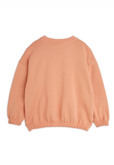 Oversized, peach-colored sweatshirt with a round neckline, elastic cuffs, and a gathered hem. Made from soft, textured fabric.