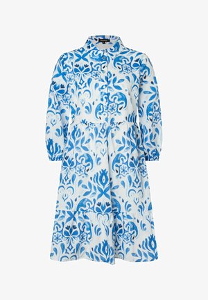 Weißes Kleid mit einem blauen Blumen- und Wirbelmuster, einem kragenförmigen Ausschnitt, Knopfleiste und langen puffärmeln mit elastischen Bündchen.