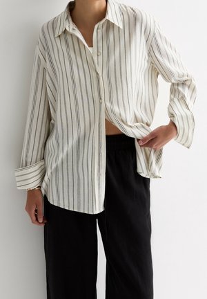 Skjortebluser - white