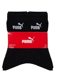 Schwarze Crew-Socken aus weichem Baumwollmaterial mit gepolsterten Sohle. Das Paket enthält sechs Paare, jeweils mit dem weißen Puma-Logo auf jeder Socke.