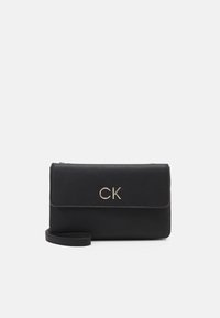 Calvin Klein RELOCK CROSSBODY BAG - Umhängetasche - black