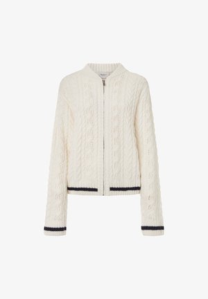 Kreminės spalvos pynimo megztinis su priekiniais užtrauktukais, turintis raukšlėtą apykaklę ir indigo juostelėmis dekoruotus rankogalius bei apačią.