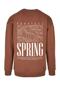 Barna pulóver, fehér trópusi levélmintával, hátulján a "SPRING" felirattal. Bordás ujjak és alsó szegély.