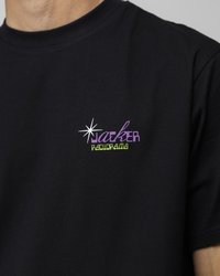 Black cotton t-shirt featuring a multi-colored logo on the chest, with "jaeker" in purple and "RADIORAMA" in green. Short sleeves.
